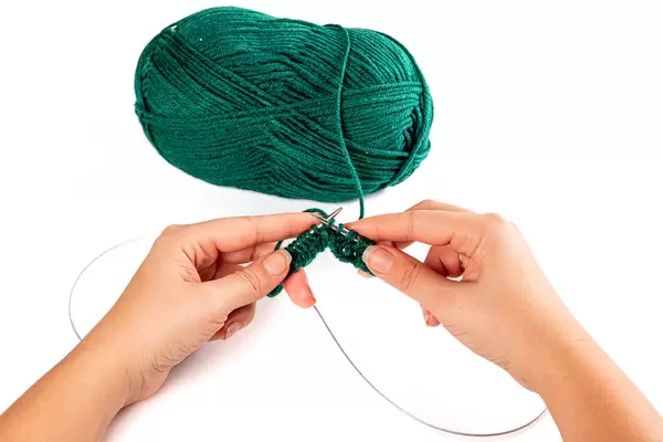 Close-up, women's hands knitting needles