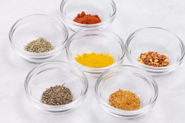Closeup image of Kitchen Spices in the glass bowls