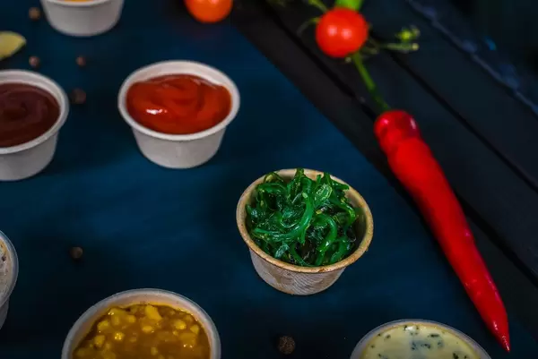 Closeup of appetizer sauces. spinach sauce