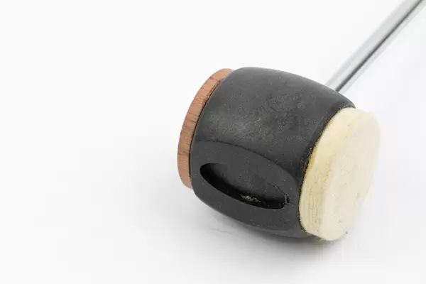 Closeup of Bass Drum Pedal Stick isolated above white background