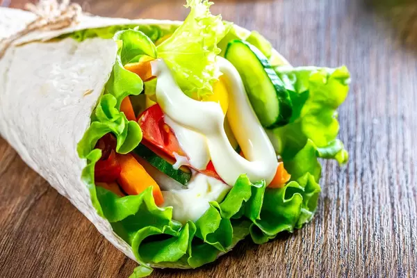 Closeup of cone - pita bread with vegetables and sauce (Flip 2019)