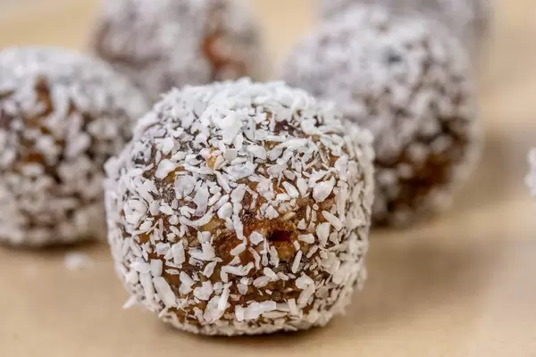 Closeup of Dates and Peanut Butter energy balls in the Coconut (Flip 2019)
