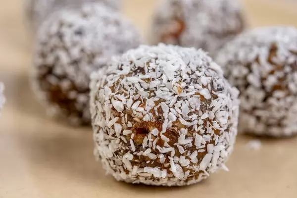 Closeup of Dates and Peanut Butter energy balls in the Coconut