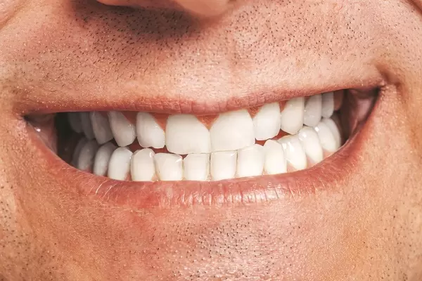 Closeup of male mouth. Healthy smile