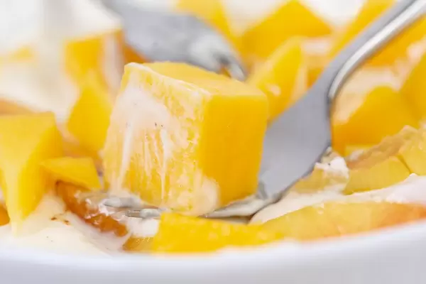 Closeup of Peaches and Mango in the Greek Yogurt (Flip 2019)