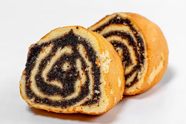Closeup of slices of biscuit roll with poppy seed filling