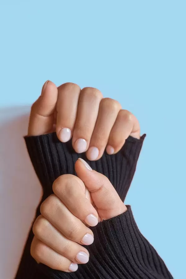 Closeup photo of a beautiful female hands with elegant manicure (Flip 2020)