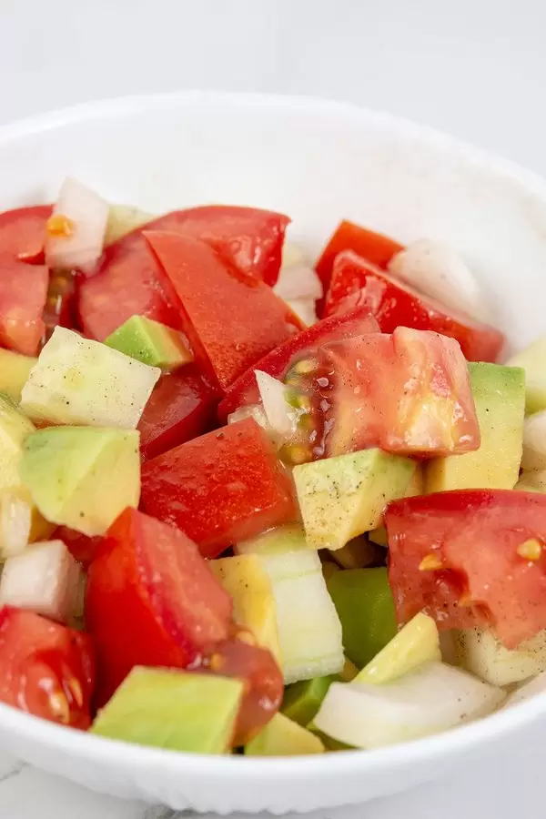 Closeup view of Avocado Tomato Onion and Cucumber Salad