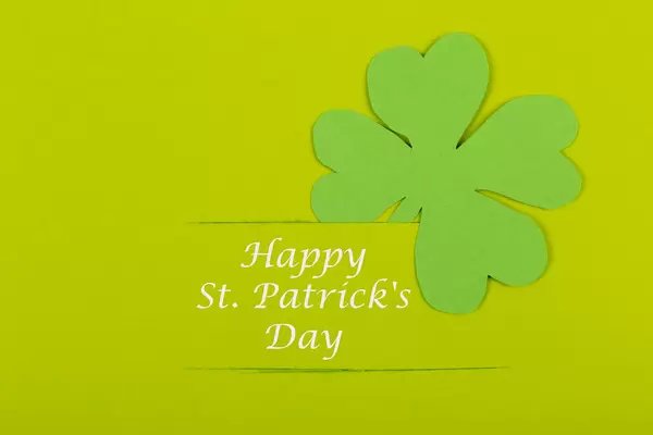 Clover leaf on green background, happy patrick's day wish