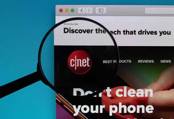 Cnet logo under magnifying glass