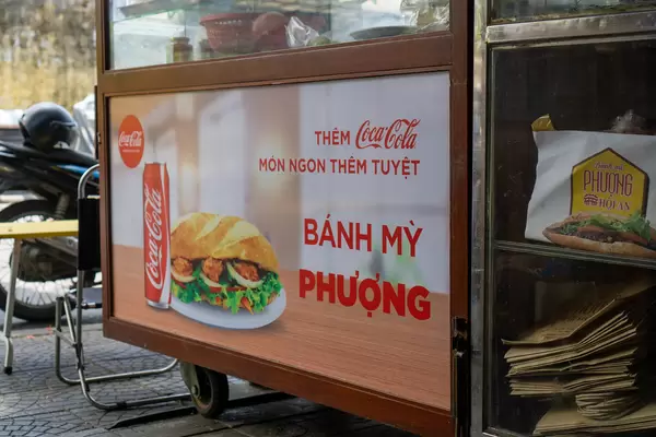 Coca Cola Advertisement on a Food Cart at famous Banh Mi Phuong Restaurant in Hoi An, Vietnam