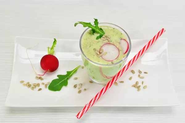 Cocktail with radish and rocket salad with sunflower seeds