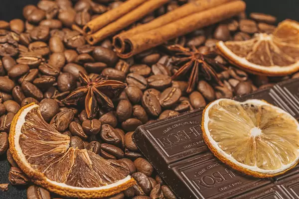 Coffee beans, dark chocolate and winter spices background