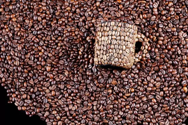 Coffee beans mug on coffee beans background (Flip 2019)
