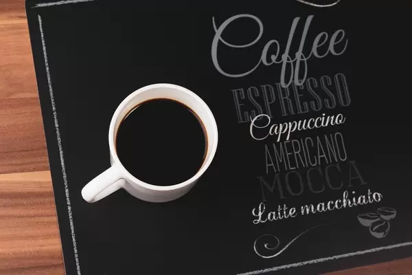 Coffee cup top view on wooden table