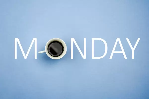 Coffee forming monday text on bright blue background