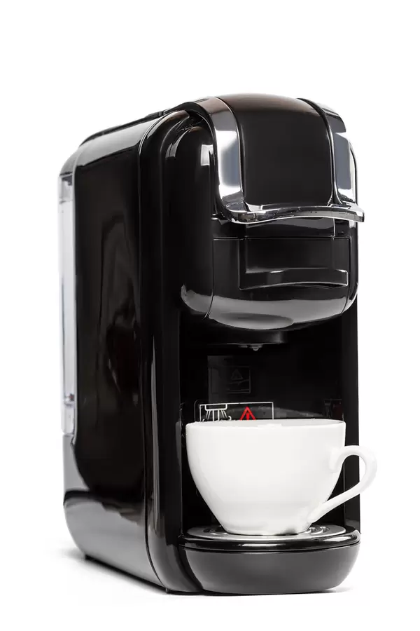 Coffee maker on a white background with white cup