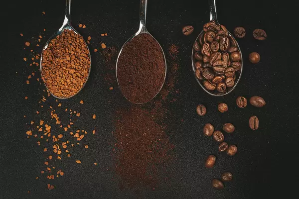 Coffee variation - powdered, instant coffee and beans in spoons