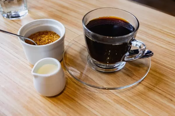 Coffee with sugar and creamer on side