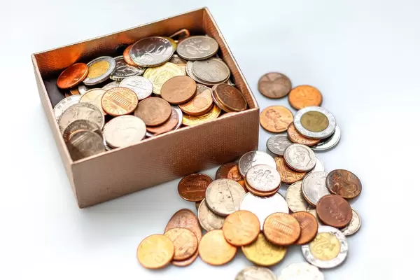 Coin in a box on a White Background