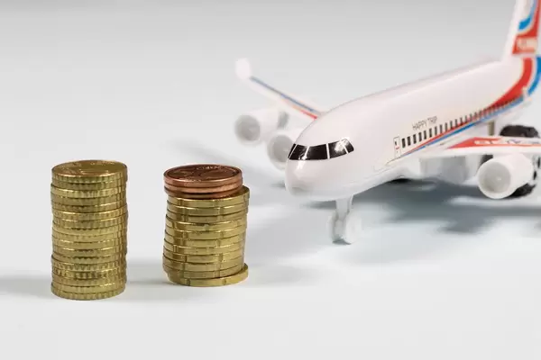 Coin stacks in front of airplane