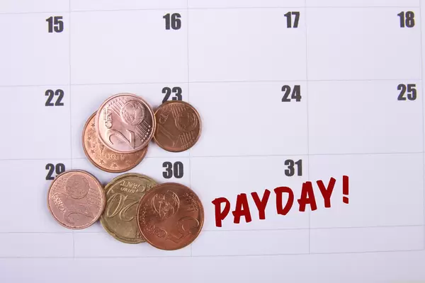 Coins and Payday text on the calendar