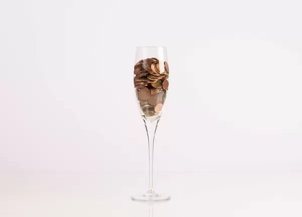 Coins in champagne glass