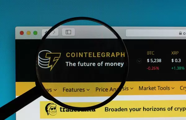Cointelegraph logo under magnifying glass