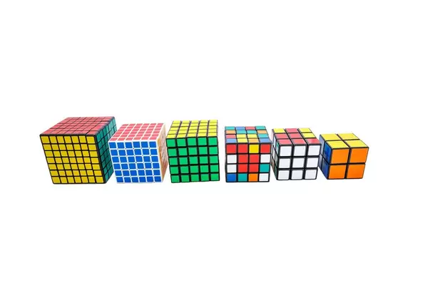 Collection of different Rubik's cubes on white background  (Flip 2019)
