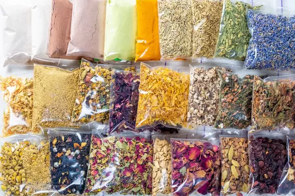 Collection of various tea-fruit, flower, deciduous and tea powders. Flat lay, top view