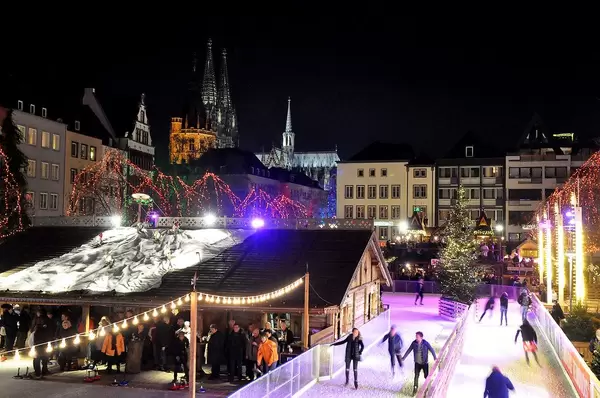 Cologne Christmas Market with Ice Skating and Curling with Cologne Cathedral in the Background