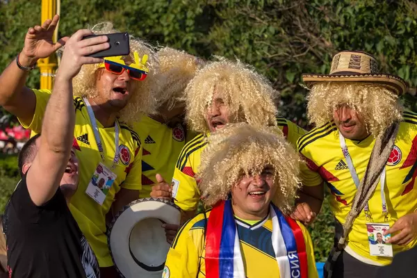 Colombian soccer fans with blonde wigs