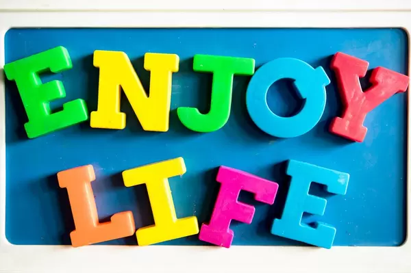 Color letters reading ENJOY LIFE