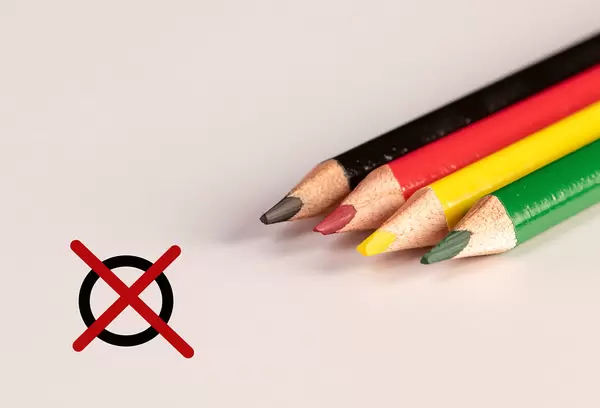Color pencils with crossed circle on white background