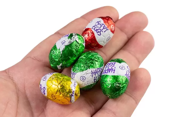 Colored Chocolate Easter Eggs in the hand