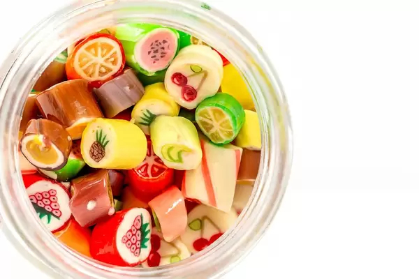 Colored fruit lollipops background