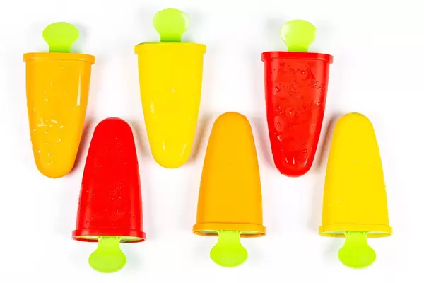 Colored ice cream makers for making ice cream at home on white, top view