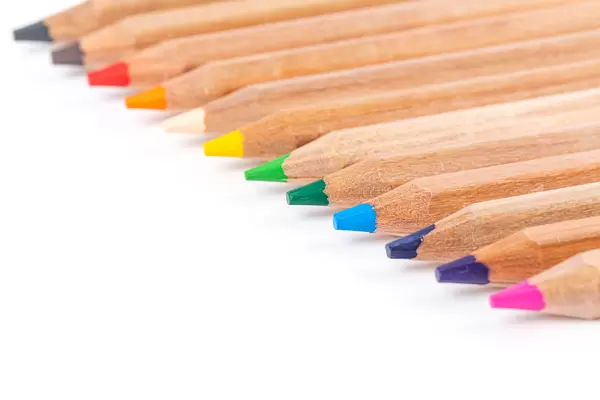 Colored pencils different colors on white