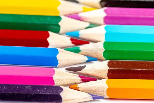 Colored pencils folded tip to each other close-up