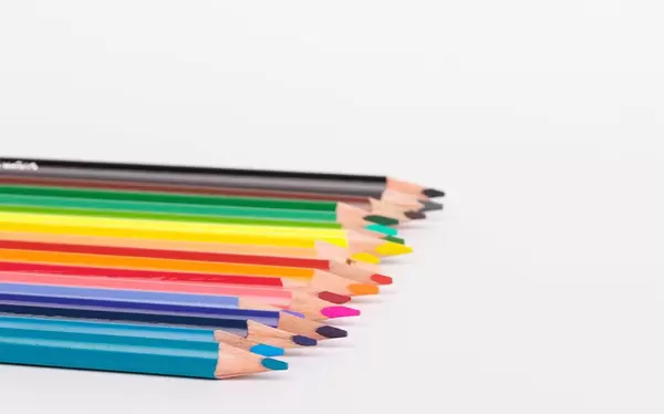 Colored pencils on white background