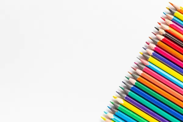 colored pencils on white paper background
