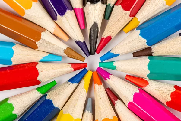 Colored pencils positioned in a circle, close up