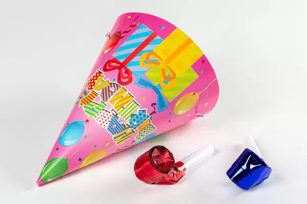 Colorful birthday cap on white background