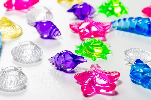 Colorful decor for aquarium in the form of seashells on a white background (Flip 2019)