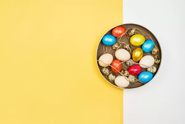 Colorful Easter eggs on bright split background