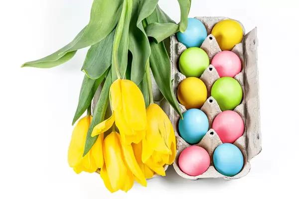 Colorful Easter eggs with a bouquet of tulips (Flip 2020)