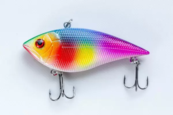 Colorful fish-lure for spinning on a white background
