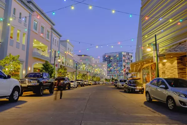 Colorful hanging lights shining across the street (Flip 2019)