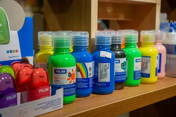 Colorful Painting Colors and Eraser in a Wooden Shelf for Sale in a Stationery Store