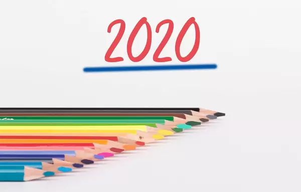 Colorful pencils on white background with text 2020